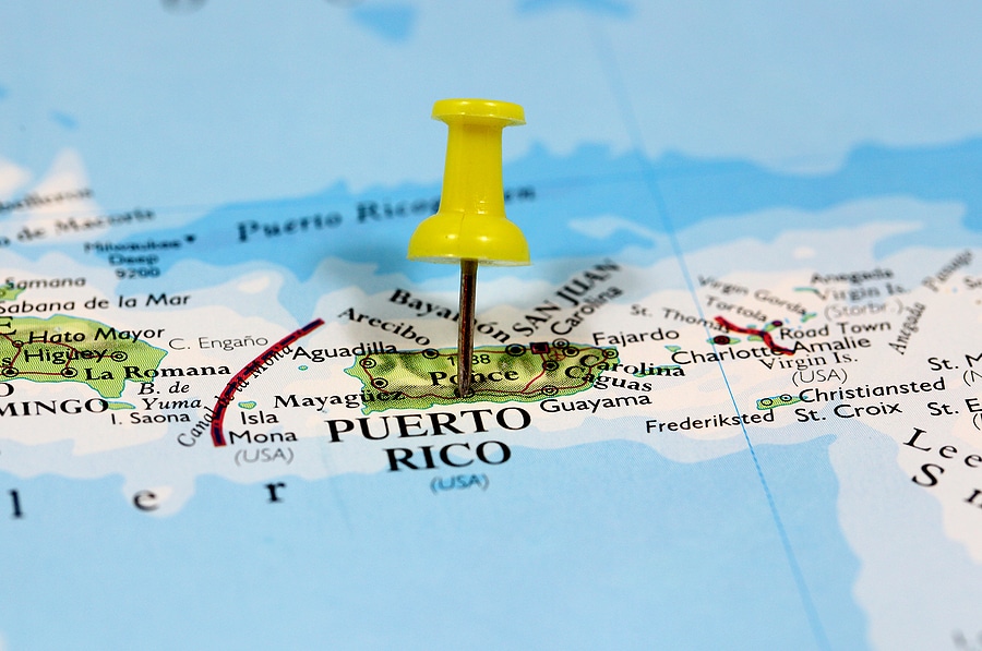 Map with yellow push-pin marking the island of Puerto Rico.
